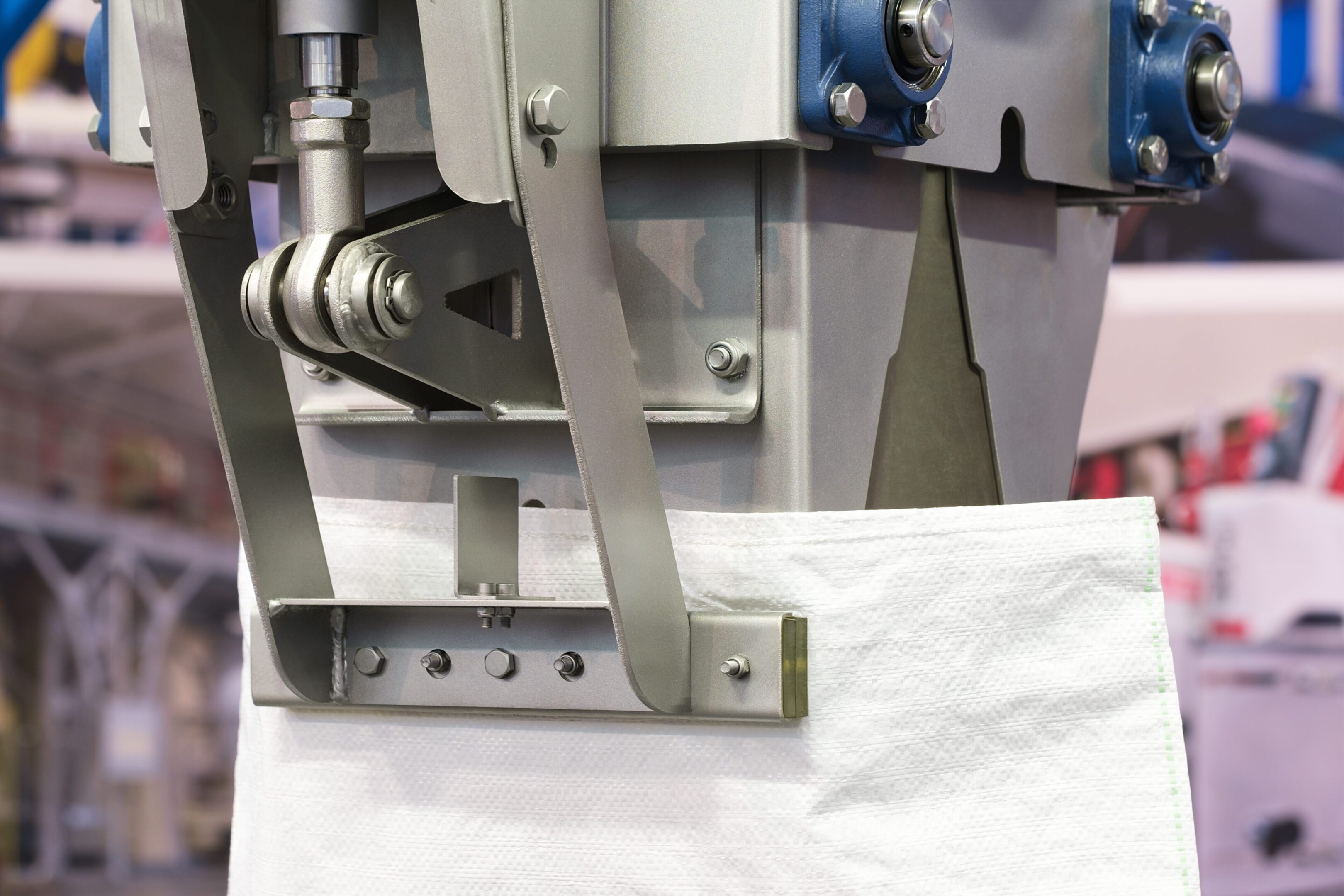 A machine is cutting paper with a knife.